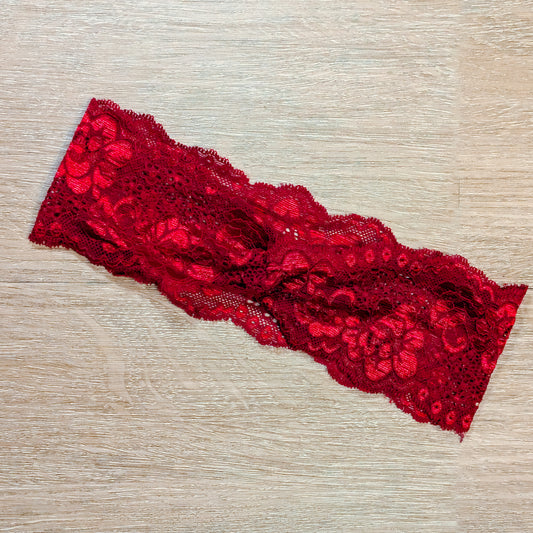 Red lace headband on a beige background