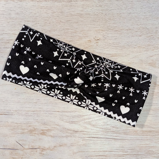 White Hearts and Snowflakes on Black Knotem
